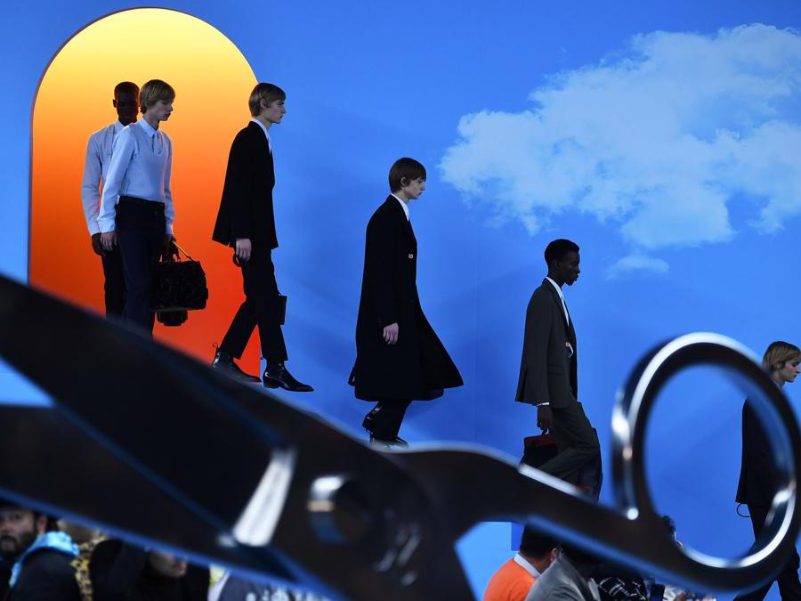 Models present creations by Louis Vuitton, during the men's Fall/Winter 2020/2021 collection fashion show in Paris on January 16, 2020. (Photo by Anne-Christine POUJOULAT / AFP)