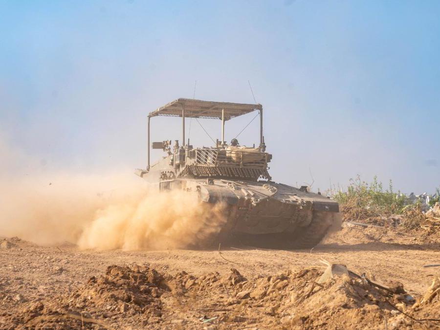 An Israeli soldier rides in a military vehicle in the Gaza Strip, amid the ongoing ground operation of the Israeli army against the Palestinian Islamist group Hamas, in this handout image released November 19, 2023. Israel Defense Forces/Handout via REUTERS THIS IMAGE HAS BEEN SUPPLIED BY A THIRD PARTY