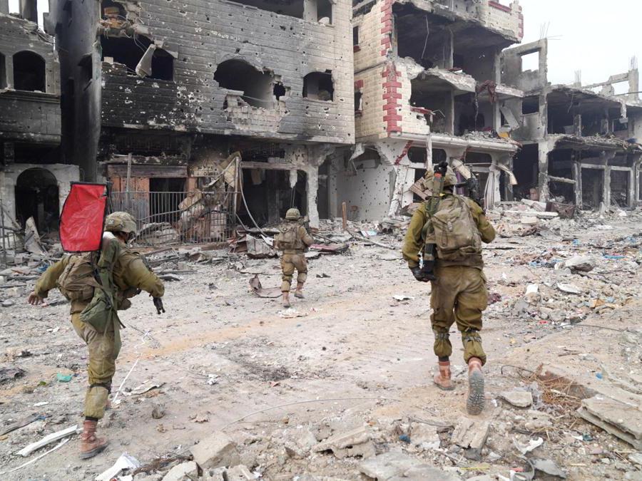 Israeli troops operate in the Gaza Strip, amid the ongoing ground operation of the Israeli army against the Palestinian Islamist group Hamas, in this handout image released November 19, 2023. Israel Defense Forces/Handout via REUTERS THIS IMAGE HAS BEEN SUPPLIED BY A THIRD PARTY