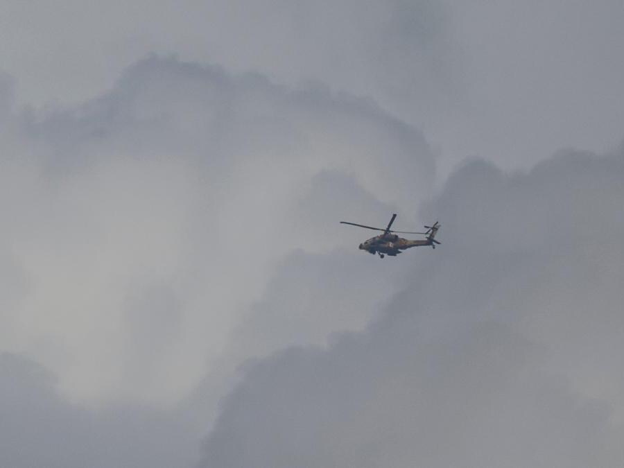 Israeli military's Apache helicopter flies over Gaza, as seen from southern Israel, amid the ongoing conflict between Israel and the Palestinian group Hamas, November 19, 2023. REUTERS/Alexander Ermochenko