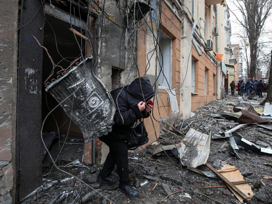 A local resident exits an apartment building damaged by a Russian missile strike, amid Russia's attack on Ukraine, in central Kharkiv, Ukraine February 5, 2023. REUTERS/Stringer