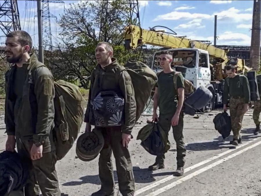 epa09962237 A still image taken from handout video made available on 21 May 2022 by the Russian Defence Ministry's press service shows Ukrainian servicemen leaving the besieged Azovstal steel plant in Mariupol, Ukraine, 20 May 2022 (issued 21 May 2022). The Chief spokesman of the Russian Defense Ministry, Major General Igor Konashenkov, said on 20 May that the Azofstal steel plant is now under full Russian army control. Russian troops entered Ukraine on 24 February 2022. EPA/RUSSIAN DEFENCE MINISTRY PRESS SERVICE/HANDOUT BEST QUALITY AVAILABLE HANDOUT EDITORIAL USE ONLY/NO SALES