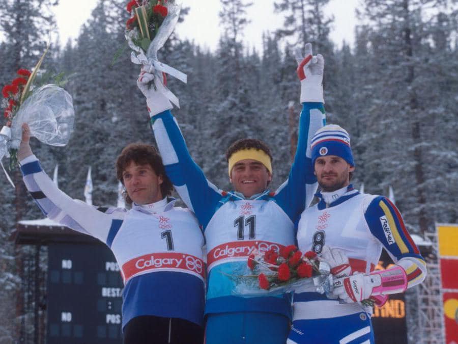 Alberto Tomba vincitore dello slalom olimpico di Calgary 88 sul podio insieme al tedesco Wordl (sin) secondo classificato e Paul Frommelt terzo classificato. (photo Pentaphoto)